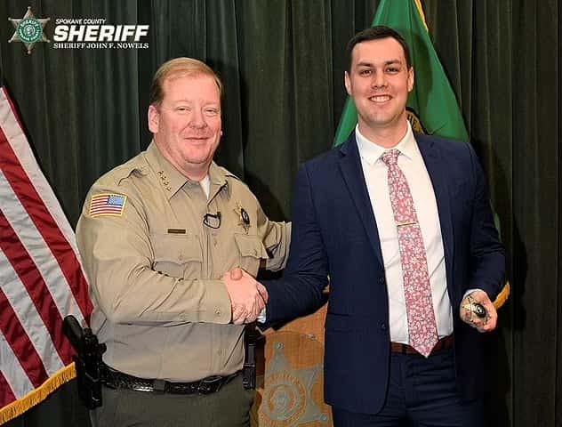 The video, posted by the Spokane County Sheriff's Office, captures Deputy Brittan Morgan (right) driving through a forestry inferno and warning residents to get out (Spokane Sheriff)

