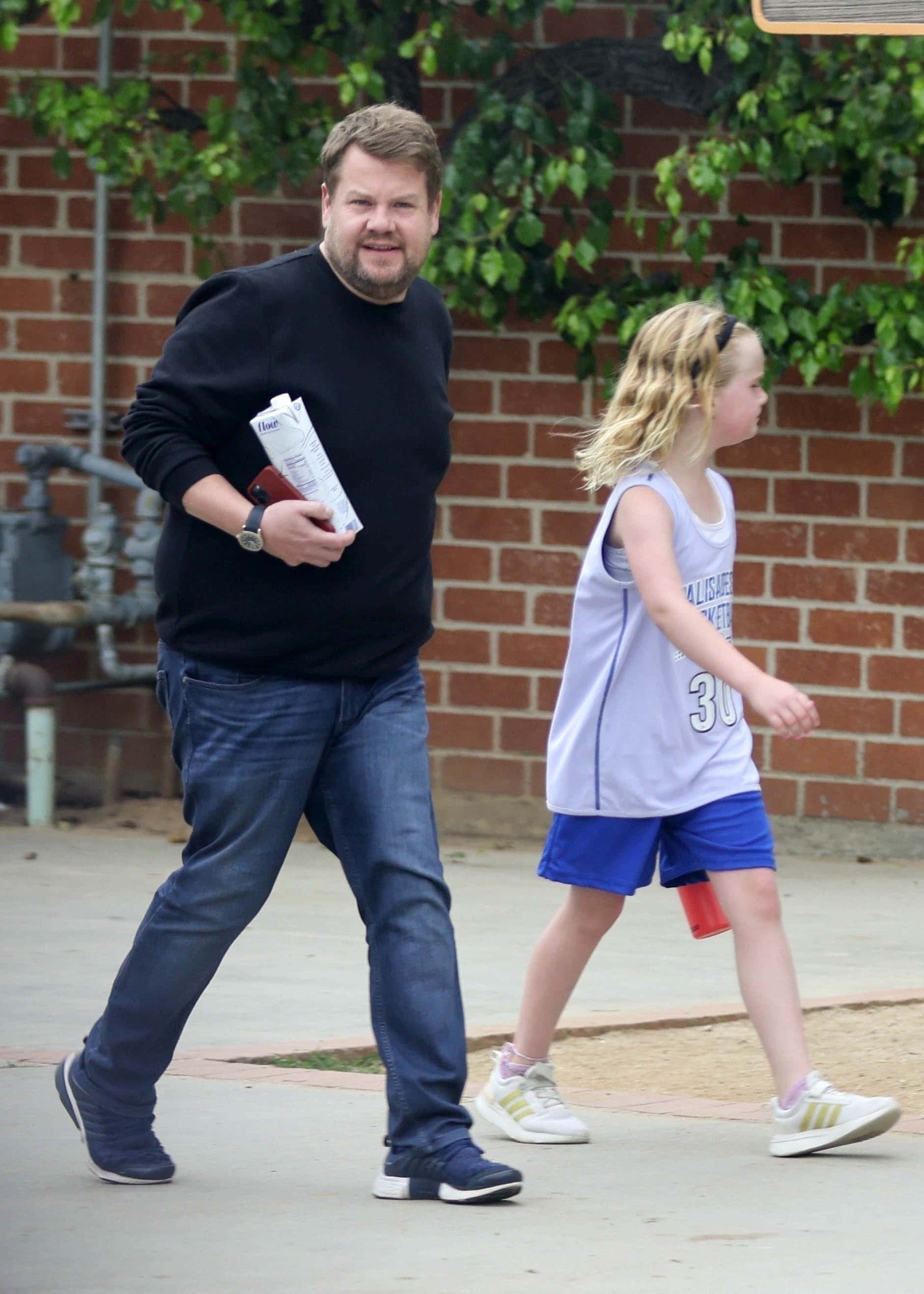 He wore a black sweatshirt, jeans, and dark blue sneakers, while Carey wore a gray basketball jersey, blue shorts, white sneakers, and a black headband in her hair (Backgrid)