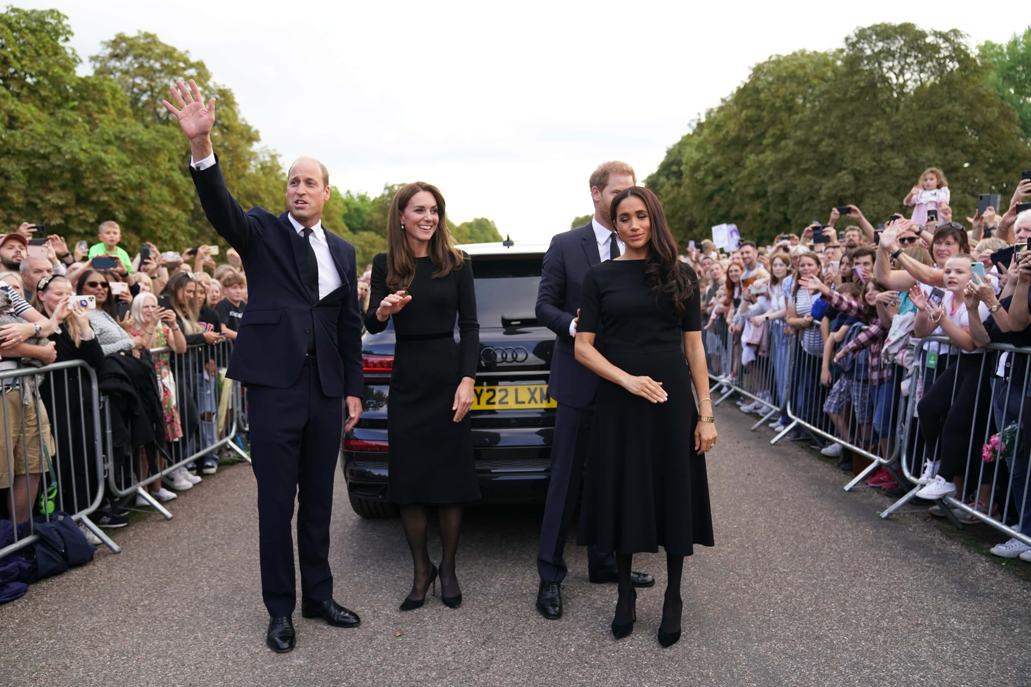 Catherine, Princess of Wales, Prince William, Prince of Wales, Prince Harry, Duke of Sussex, and Meghan, Duchess of Sussex meet members of the public on the long Walk at Windsor Castle on September 10, 2022 in Windsor, England. Crowds have gathered and tributes left at the gates of Windsor Castle to Queen Elizabeth II, who died at Balmoral Castle on 8 September, 2022. (Photo by Kirsty O'Connor - WPA Pool/Getty Images)