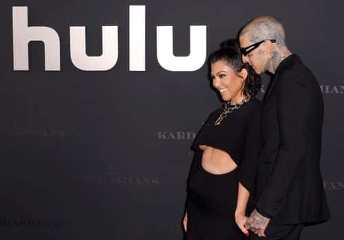 (L-R) Kourtney Kardashian and Travis Barker attend the Los Angeles premiere of Hulu's new show 