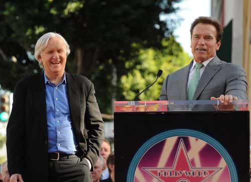 Governor of California Arnold Schwarzenegger (R) speaks on stage with director James Cameron, who was honored on The Hollywood Walk Of Fame with his own star on December 18, 2009 in Hollywood, California.