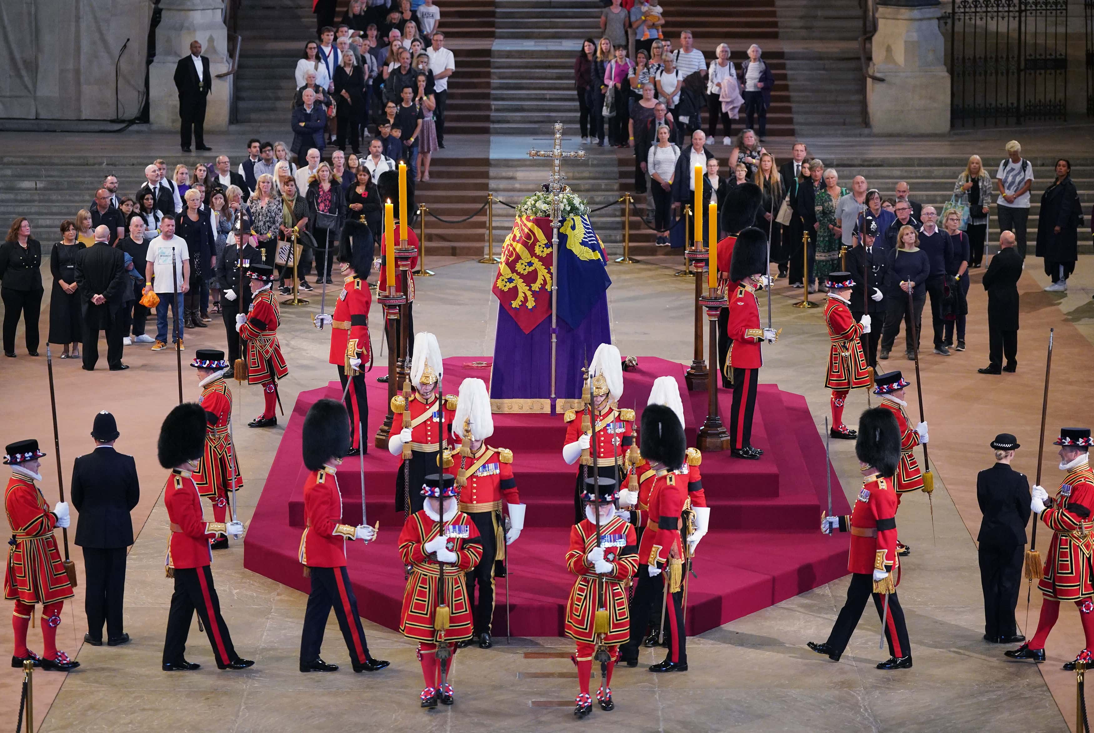 The first members of the public pay their respects as the vigil begins around the coffin of Queen Elizabeth II as it Lies in State inside Westminster Hall, at the Palace of Westminster on September 14, 2022 in London, England. Members of the public are able to pay respects to Her Majesty Queen Elizabeth II for 23 hours a day from 17:00 on September 14, 2022 until 06:30 on September 19, 2022.  Queen Elizabeth II died at Balmoral Castle in Scotland on September 8, 2022, and is succeeded by her eldest son, King Charles III.
