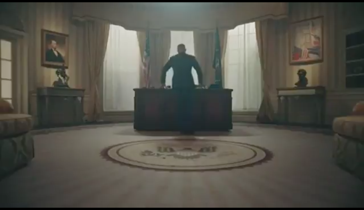 T.I. can be seen standing in the video in a room similar to the Oval Office.