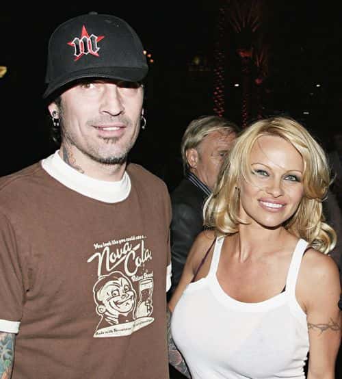 Pamela Anderson and Tommy Lee arrive at the Rodeo Drive Walk of Style Event Honoring Tom Ford on March 28, 2004 in Beverly Hills, California.