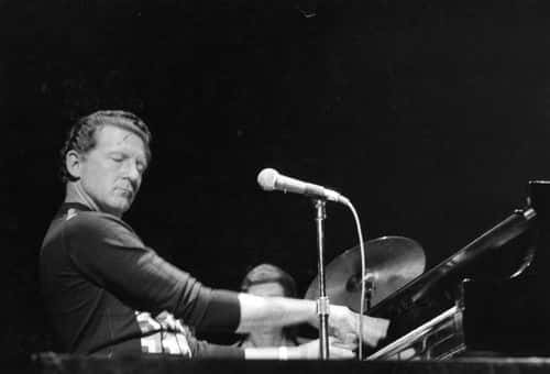 Piano pounding American rock 'n' roll singer 'the Killer' Jerry Lee Lewis, engrossed during a live performance.