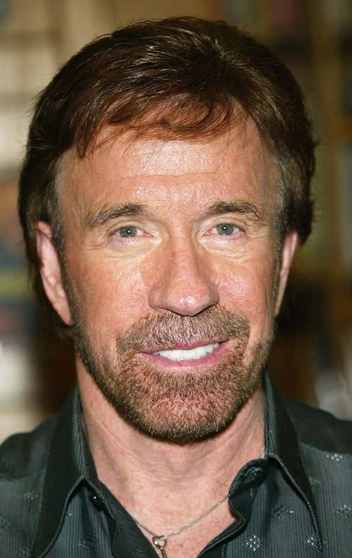 Actor Chuck Norris  poses during a book signing for his new book 