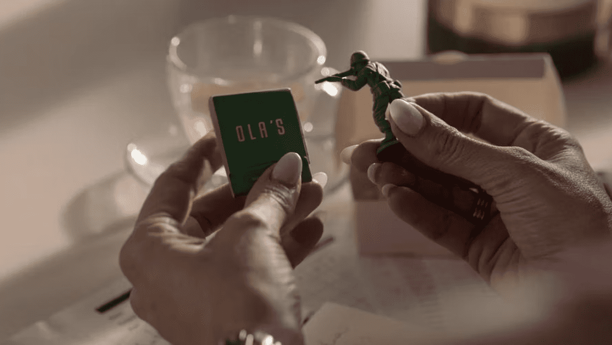 Rebecca Welton holding green matchbox represeting Sam and toy soldier representing Ted Lasso in 'Ted Lasso' (Apple TV+)