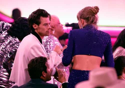 (FOR EDITORIAL USE ONLY) (L-R) Harry Styles and Taylor Swift speak during the 65th GRAMMY Awards at Crypto.com Arena on February 05, 2023 in Los Angeles, California.