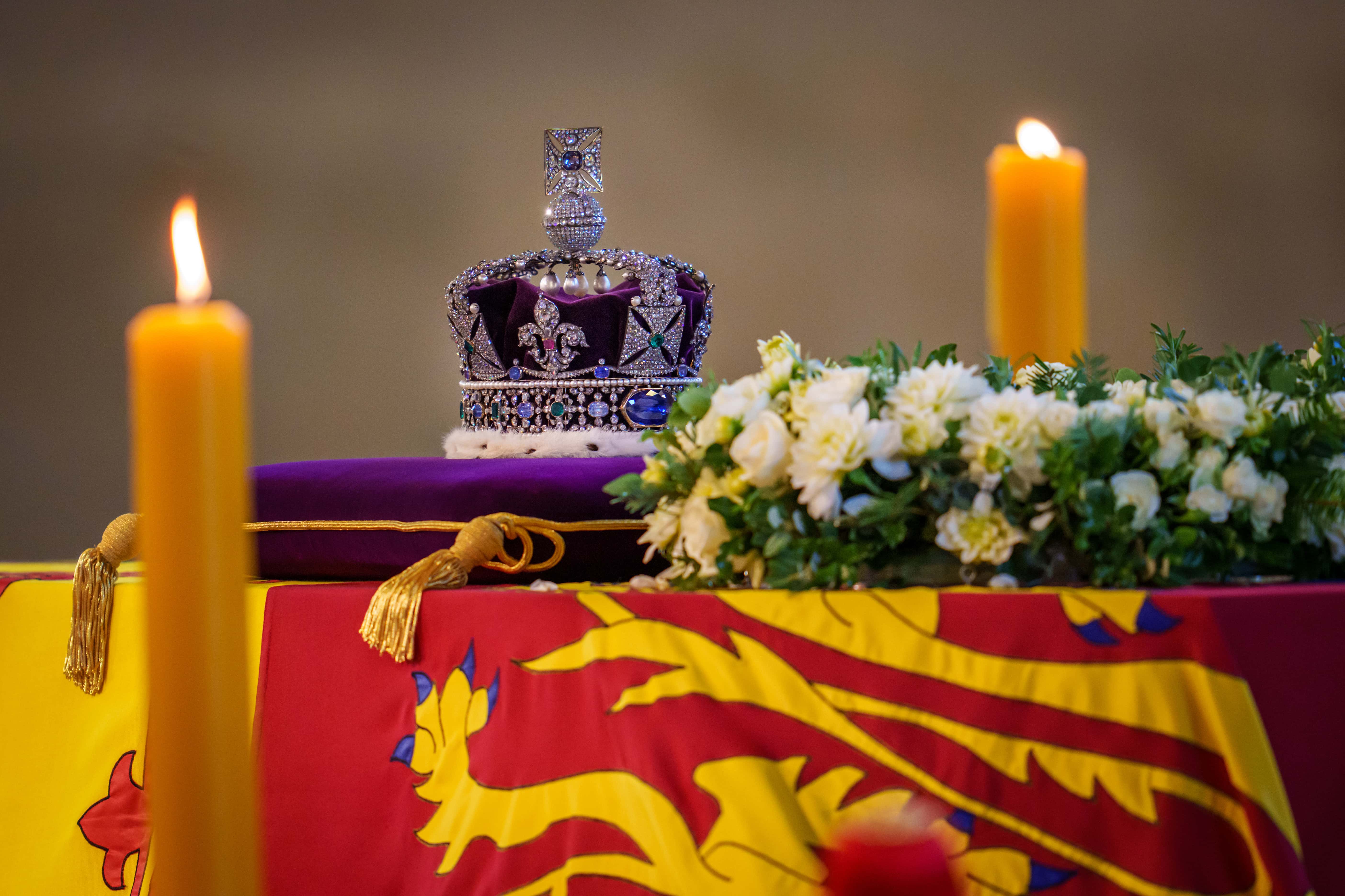 A general view of the Imperial State Crown as the coffin carrying Queen Elizabeth II rests in Westminster Hall for the Lying-in State on September 14, 2022 in London, England. Queen Elizabeth II's coffin is taken in procession on a Gun Carriage of The King's Troop Royal Horse Artillery from Buckingham Palace to Westminster Hall where she will lay in state until the early morning of her funeral. Queen Elizabeth II died at Balmoral Castle in Scotland on September 8, 2022, and is succeeded by her eldest son, King Charles III.