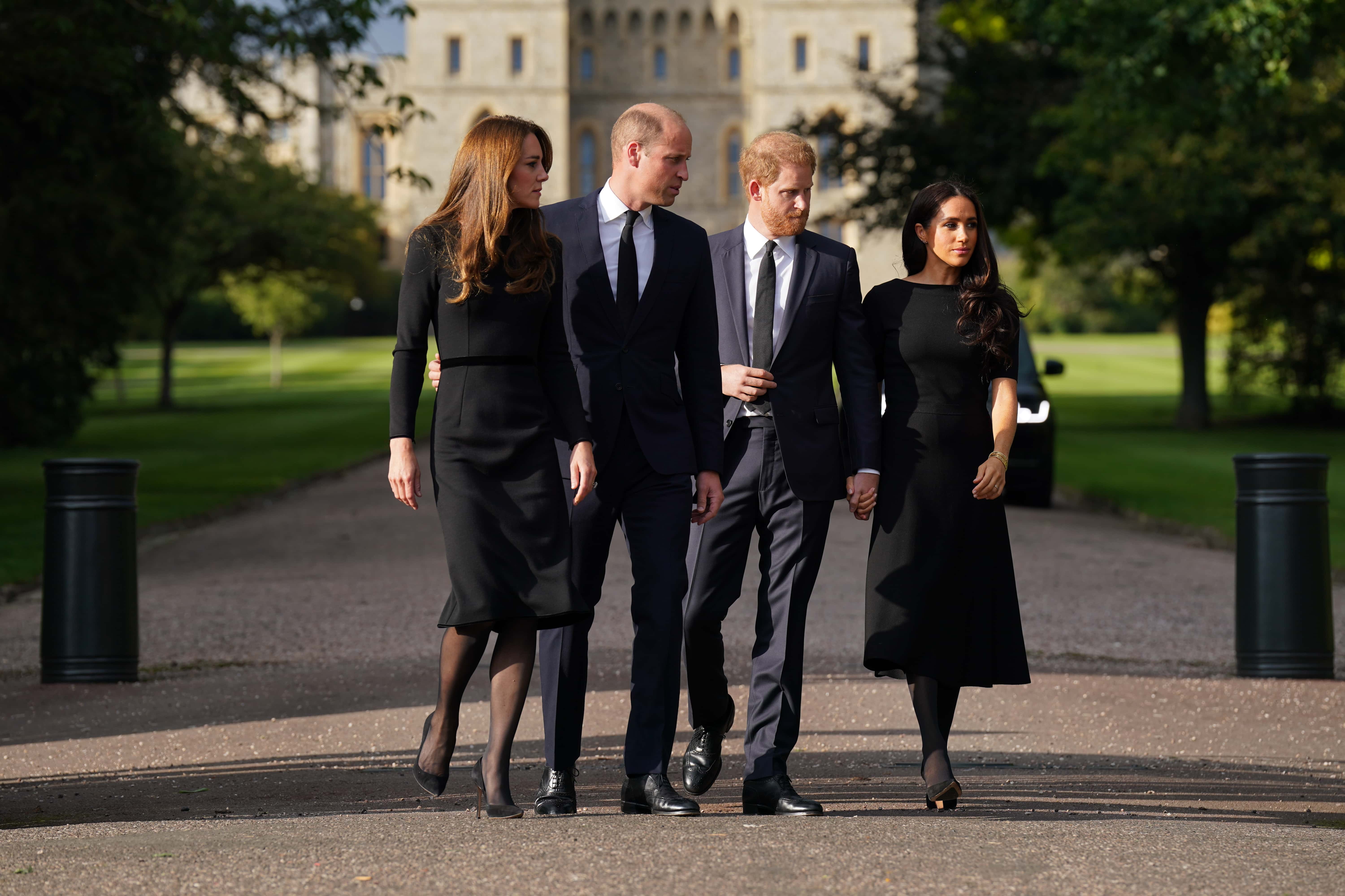 Catherine, Princess of Wales, Prince William, Prince of Wales, Prince Harry, Duke of Sussex, and Meghan, Duchess of Sussex on the long Walk at Windsor Castle on September 10, 2022 in Windsor, England. Crowds have gathered and tributes left at the gates of Windsor Castle to Queen Elizabeth II, who died at Balmoral Castle on 8 September, 2022. (Photo by Kirsty O'Connor - WPA Pool/Getty Images)