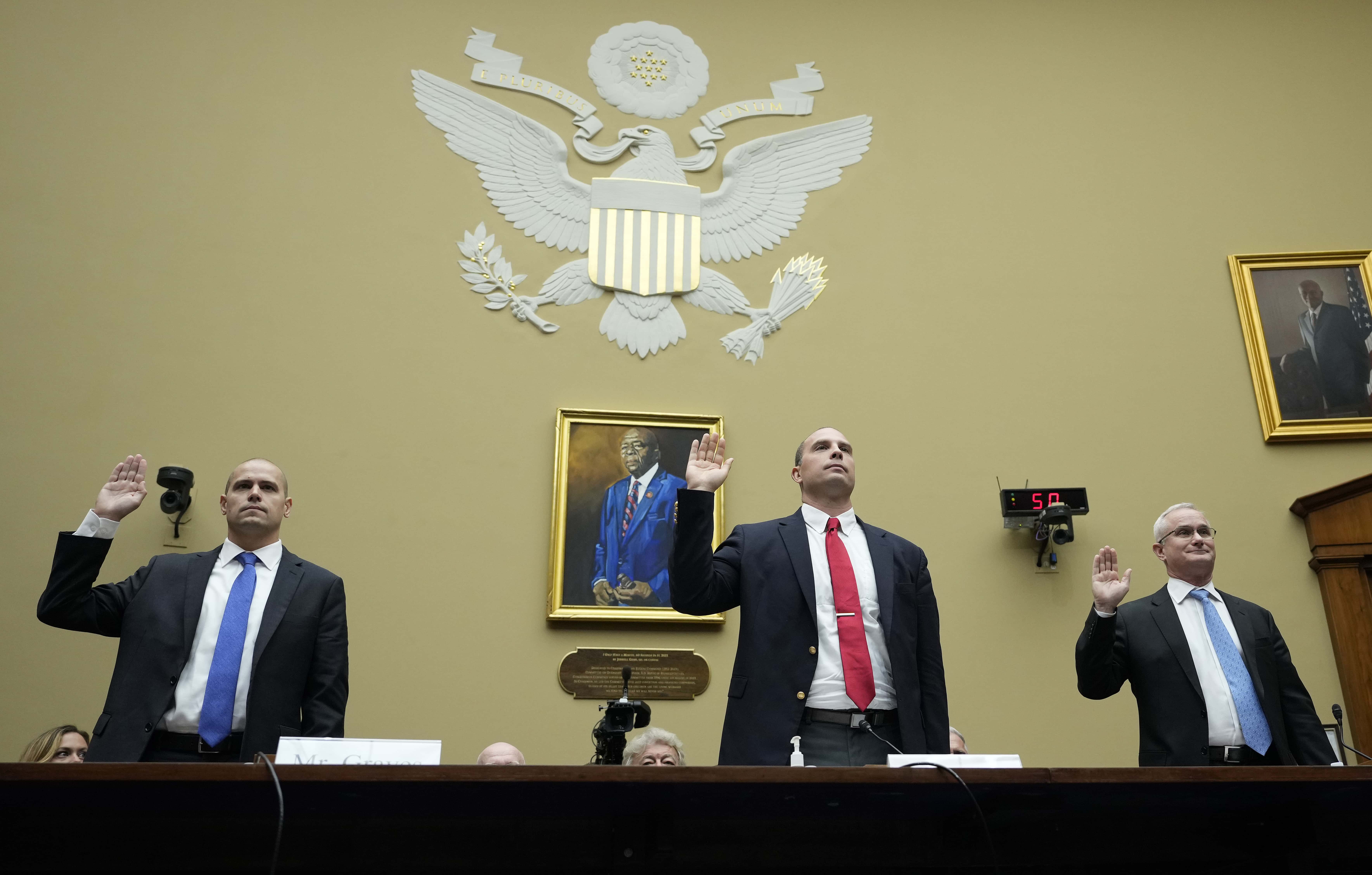 WASHINGTON, DC - JULY 26: Ryan Graves, executive director of Americans for Safe Aerospace, David Grusch, former National Reconnaissance Officer Representative of Unidentified Anomalous Phenomena Task Force at the U.S. Department of Defense, and Retired Navy Commander David Fravor are sworn-in during a House Oversight Committee hearing titled “Unidentified Anomalous Phenomena: Implications on National Security, Public Safety, and Government Transparency” on Capitol Hill 26, 2023 in Washington, DC. Several witnesses are testifying about their experience with possible UFO encounters and discussion about a potential covert government program concerning debris from crashed, non-human origin spacecraft. (Photo by Drew Angerer/Getty Images)
