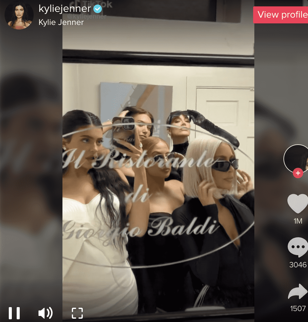 Kylie Jenner with her sisters wearing a white dress (Kylie Jenner/TikTok)