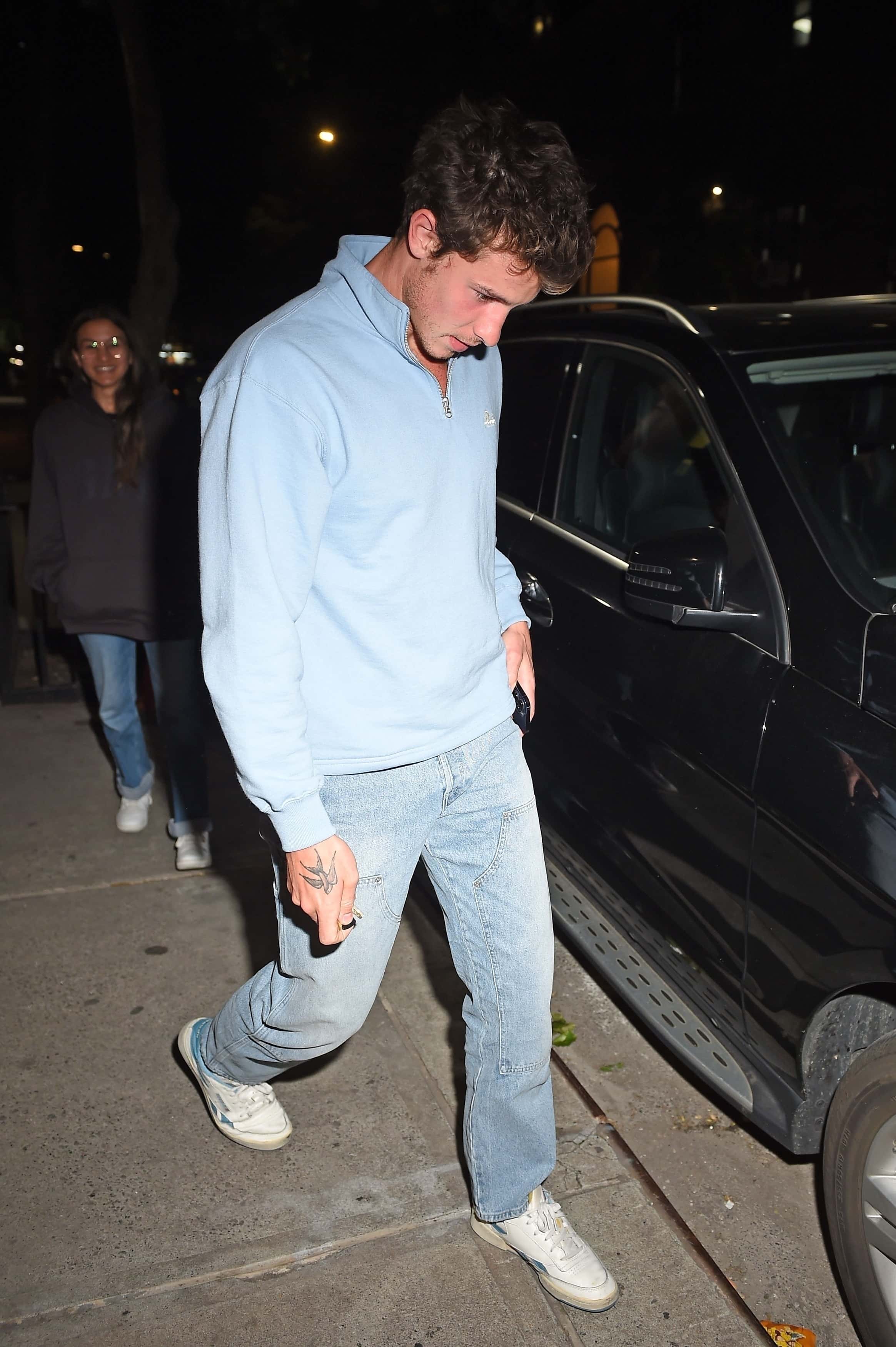 The Canadian-born star looked to be playing the shy role when he met up with Cabello ahead of their dinner date by covering his face at times and keeping his head down (Backgrid)