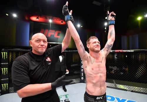 In this handout image provided by UFC, Kevin Croom reacts after his submission victory over Roosevelt Roberts in a lightweight fight during the UFC Fight Night event at UFC APEX on September 12, 2020 in Las Vegas, Nevada.