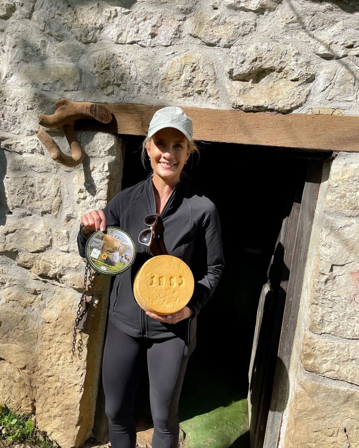Dana Perino posing with cheese made in Asturia, Spain (@danaperino/Instagram)