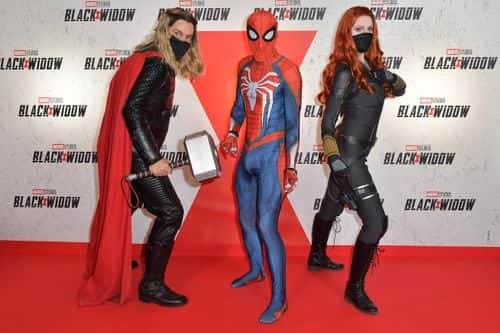 Guests dressed as Thor, Spiderman and Black Widow attend the “Black Widow” Paris Gala Screening at cinema Le Grand Rex on June 30, 2021 in Paris, France.