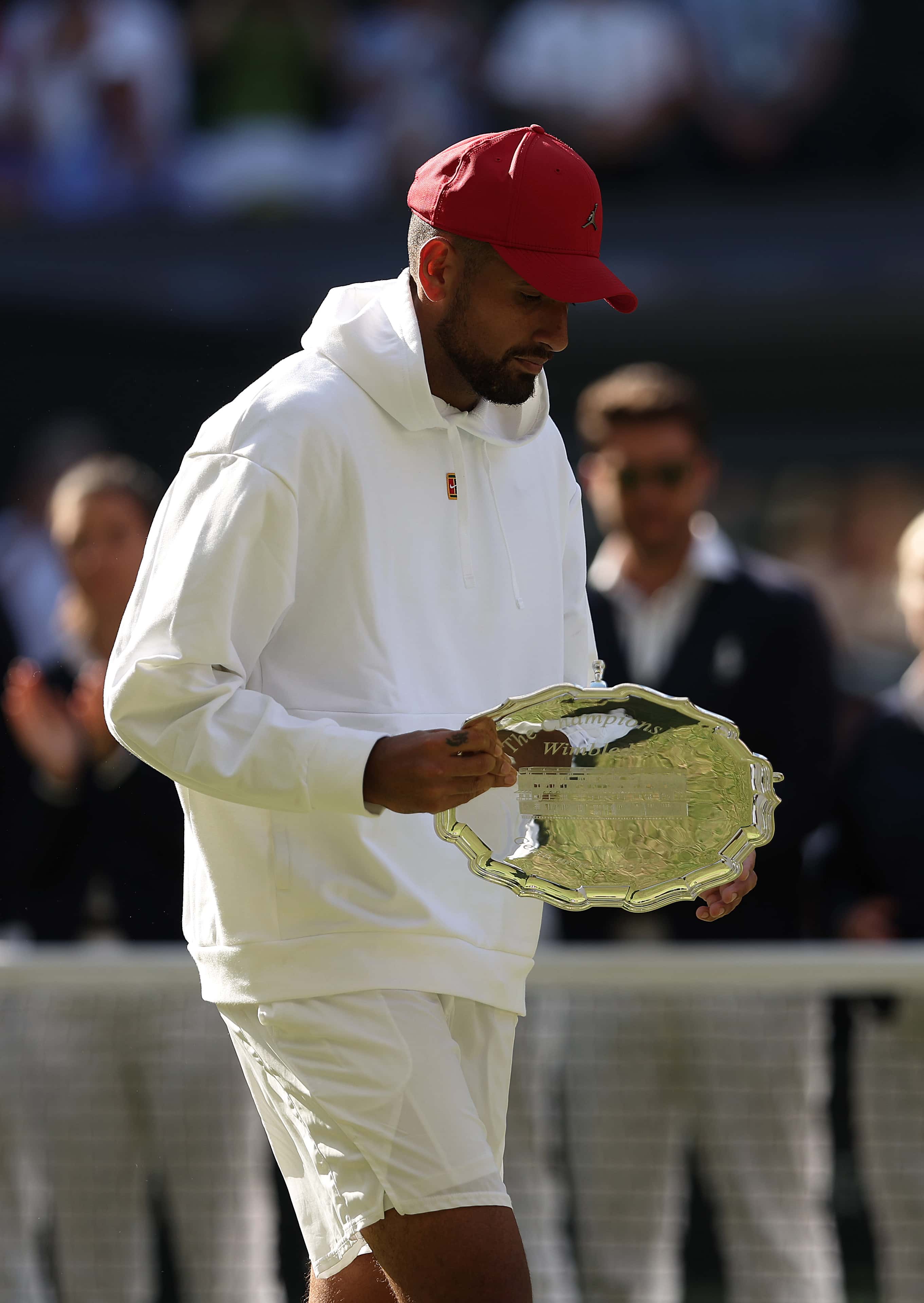 Runner up Nick Kyrgios of Australia looks on with his runner up trophy following his defeat to Novak Djokovic of Serbia in their Men's Singles Final match on day fourteen of The Championships Wimbledon 2022 at All England Lawn Tennis and Croquet Club on July 10, 2022 in London, England. (Photo by Julian Finney/Getty Images)
