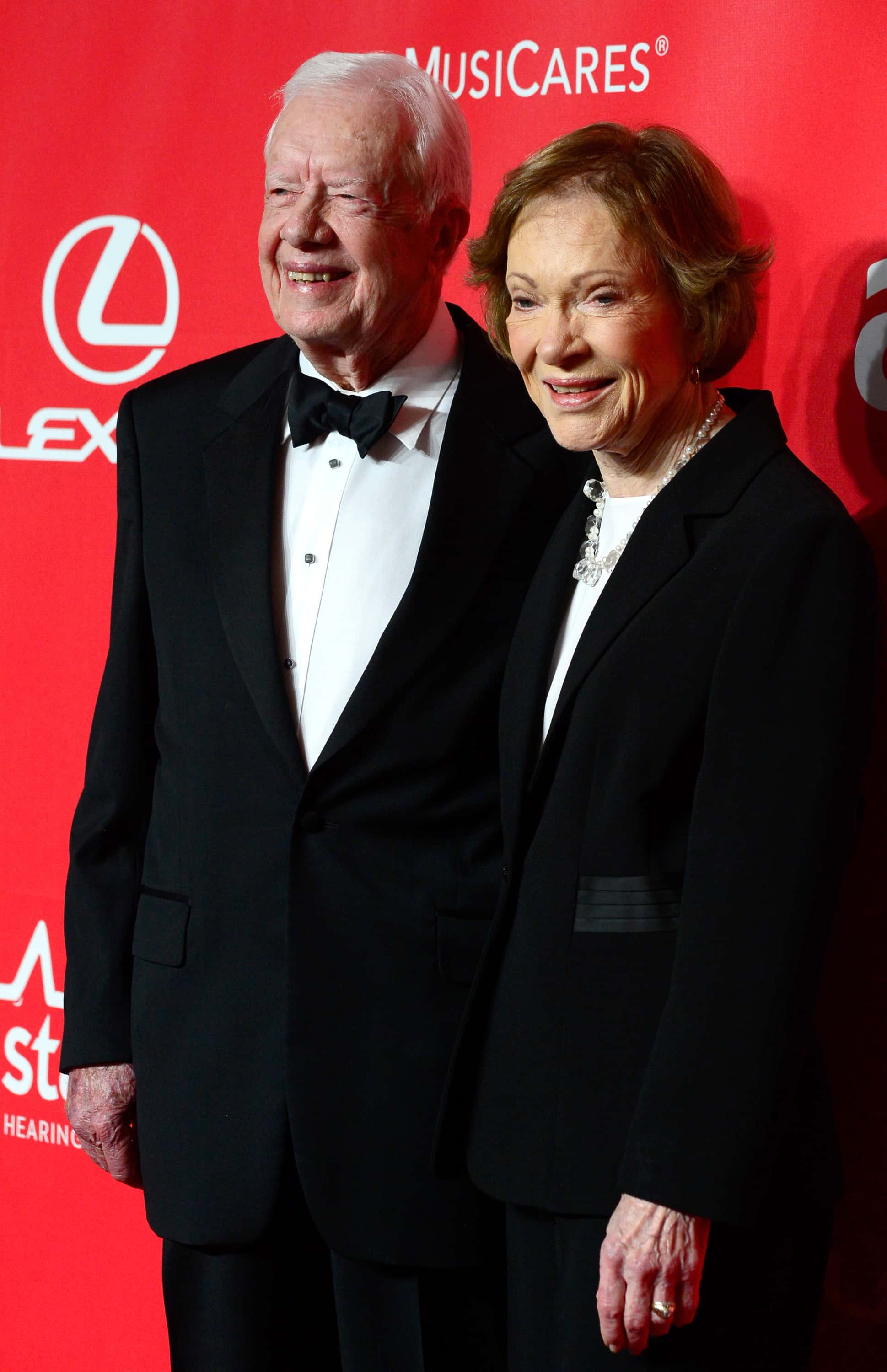 Former U.S. President Jimmy Carter (L) and former First Lady Rosalynn Carter attend the 25th anniversary MusiCares 2015 Person Of The Year Gala honoring Bob Dylan at the Los Angeles Convention Center on February 6, 2015 in Los Angeles, California. The annual benefit raises critical funds for MusiCares' Emergency Financial Assistance and Addiction Recovery programs. (Photo by Frazer Harrison/Getty Images)