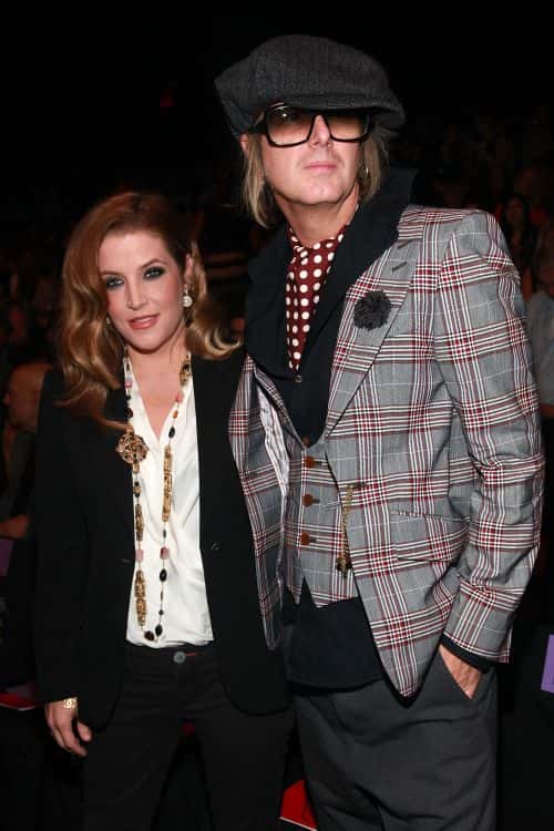 Lisa Marie Presley (L) and Michael Lockwood (R) attend the Anna Sui Spring 2012 fashion show during Mercedes-Benz Fashion Week at The Theater at Lincoln Center on September 14, 2011 in New York City.