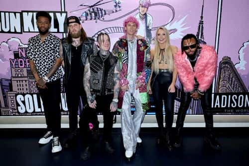Machine Gun Kelly and his band pose backstage during Machine Gun Kelly At Madison Square Garden on June 28, 2022 in New York City.
