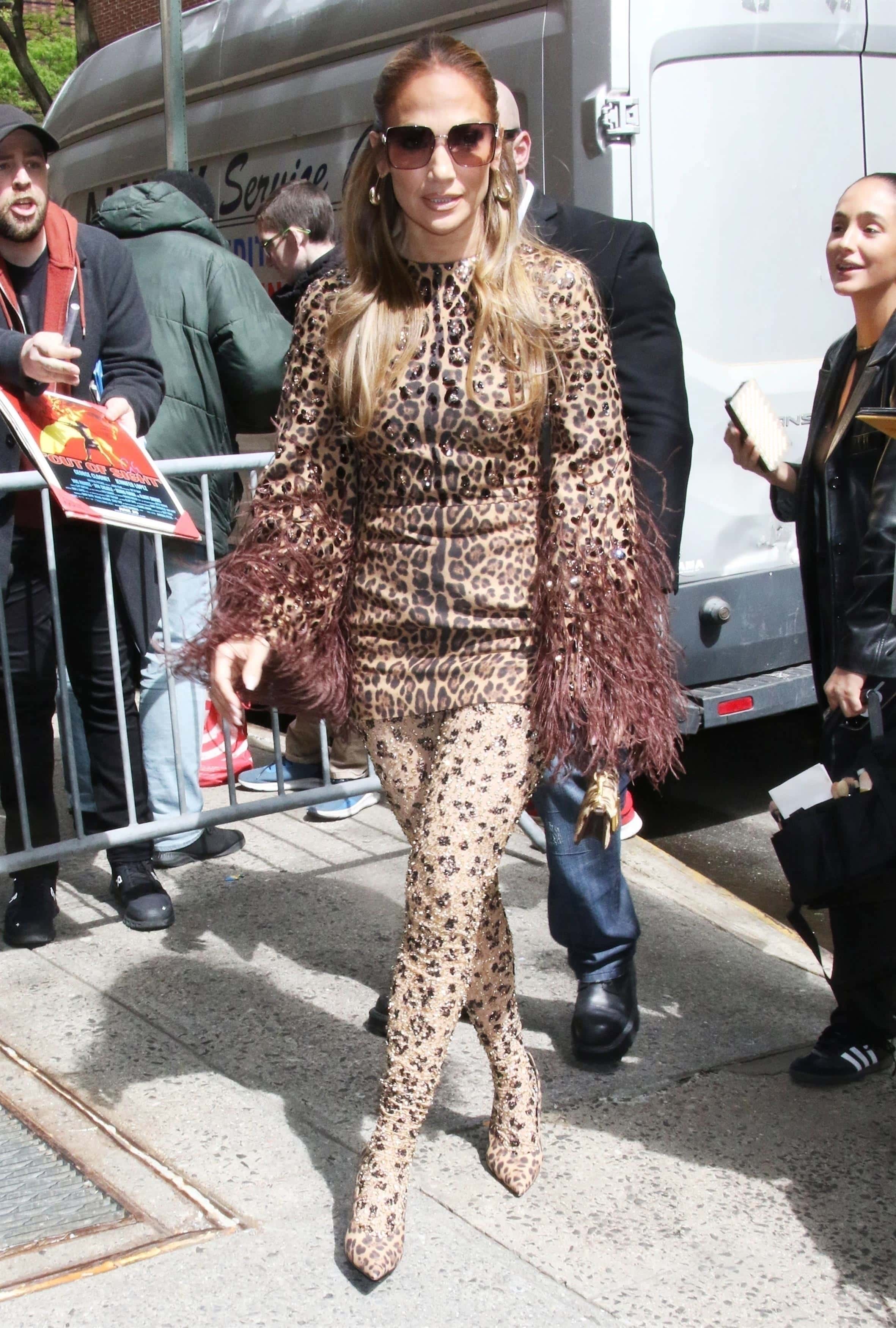 The superstar, who has been promoting her new film The Mother, strutted her stuff in a spotted tunic with fringe on the sleeves and cheetah print leggings and heels (Backgrid)