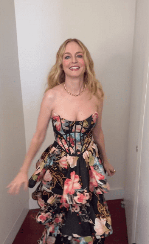 For her appearance on the talk show, she modeled the low-cut black dress adorned with bright and colorful flower designs and twirled for her Instagram latest post (heathergraham/Instagram)