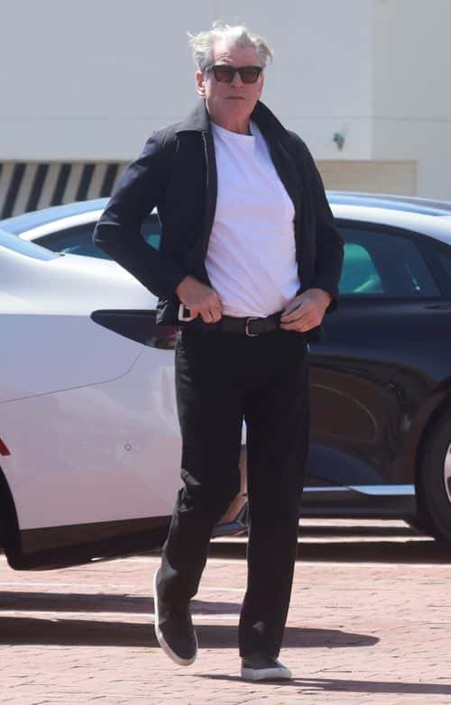 Casually cool, Pierce added a pair of black jeans to the dressed-down look, also donning blue trainers (Backgrid)