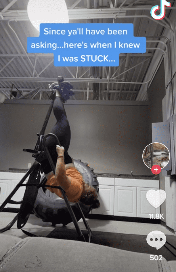 Christine Faulds get stuck on an inversion table at 3 am in her gym and calls 911 for assistance. (TikTok/@cfaulds20)