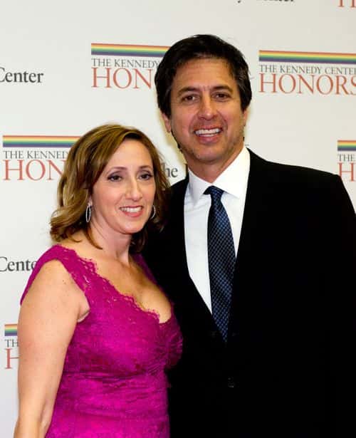 Ray Romano and his wife, Anna (R) arrive for a dinner for Kennedy honorees hosted by U.S. Secretary of State Hillary Rodham Clinton at the U.S. Department of State on December 1, 2012 in Washington, DC. The 2012 honorees are Buddy Guy, actor Dustin Hoffman, late-night host David Letterman, dancer Natalia Makarova, and members of the British rock band Led Zeppelin Robert Plant, Jimmy Page, and John Paul Jones. (Photo by Ron Sachs - Pool/Getty Images)