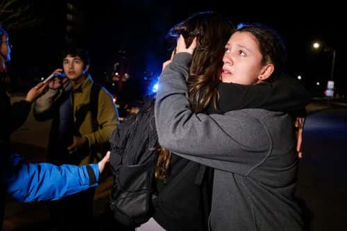 Michigan State University students hug during an active shooter situation on campus on February 13, 2023 in Lansing, Michigan. Five people were shot and the gunman still at large following the attack, according to published reports. The reports say some of the victims have life-threatening injuries.