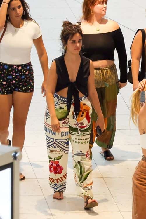 Camila Cabello topped her look off with a pair of leather thong sandals (Backgrid)
