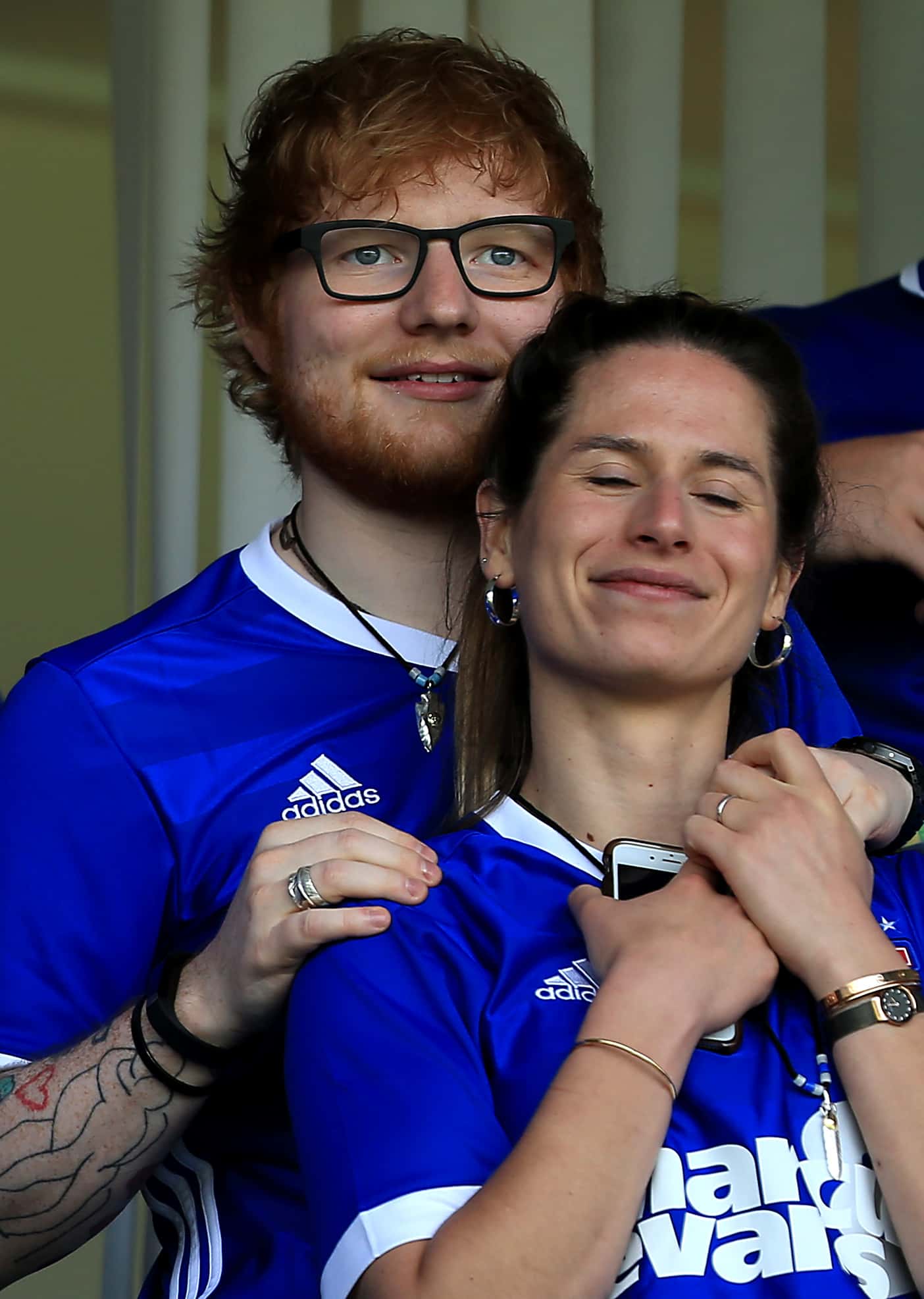 Musician Ed Sheeran and fiance Cherry Seaborn look on during the Sky Bet Championship match between Ipswich Town and Aston Villa at Portman Road on April 21, 2018 in Ipswich, England.