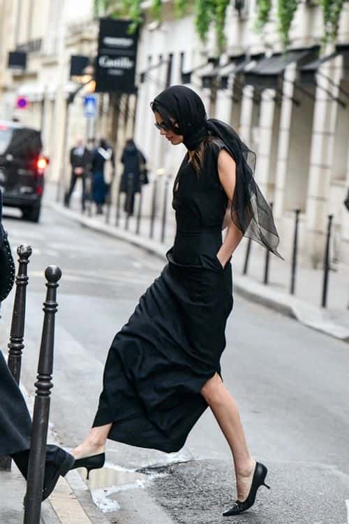 The model dressed up for the game by sporting a Bottega faux fur coat and patterned cap that partially covered her brunette locks (Backgrid)