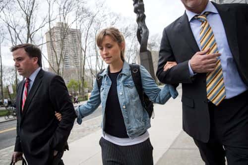 Actress Allison Mack leaves U.S. District Court for the Eastern District of New York after a bail hearing, April 24, 2018 in the Brooklyn borough of New York City. Mack was charged last Friday with sex trafficking for her involvement with a self-help organization for women that forced members into sexual acts with their leader. The group, called Nxivm, was led by founder Keith Raniere, who was arrested in March on sex-trafficking charges. She was released on bail at $5 million.