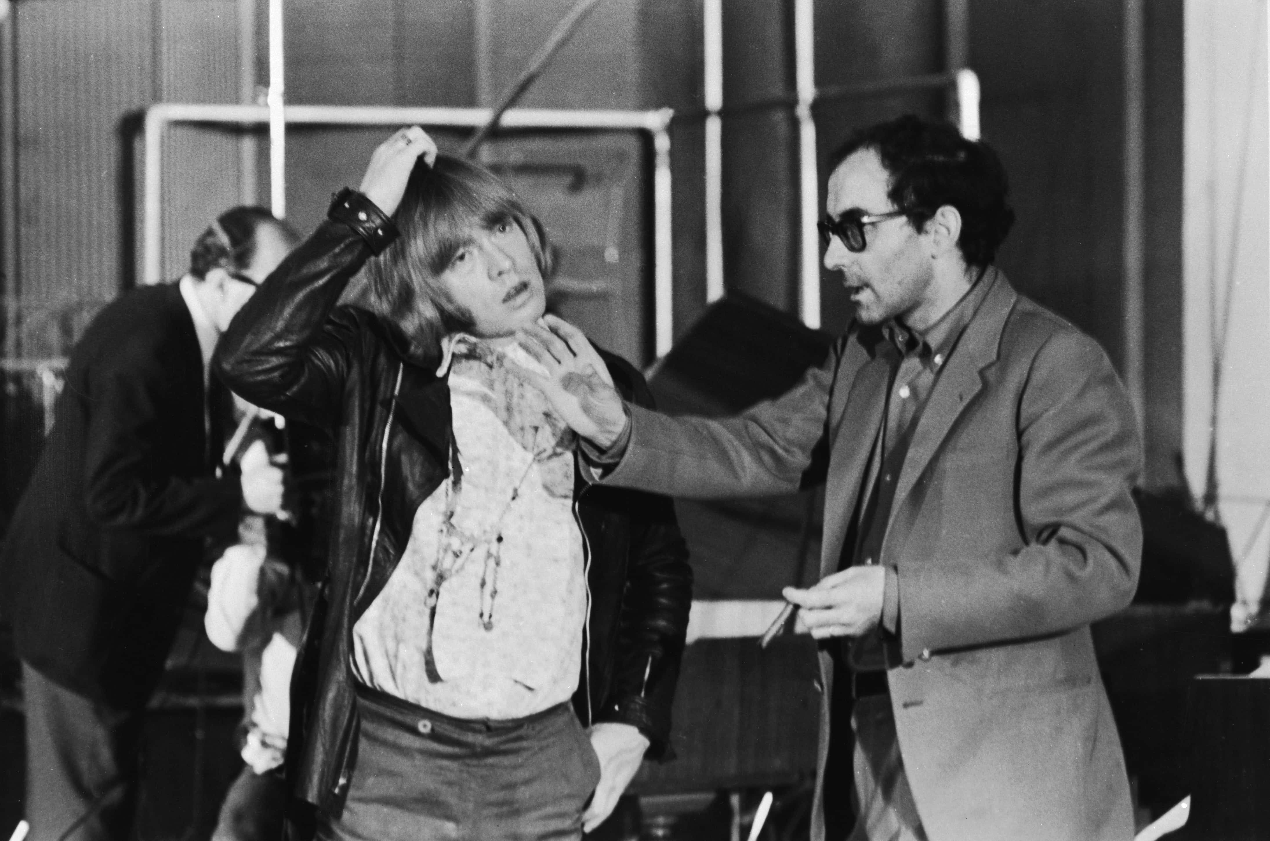 Jean-Luc Godard (right) directs Brian Jones (1942 - 1969) of the Rolling Stones during the shooting of the documentary film 'Sympathy For the Devil' (aka 'One Plus One'), 30th July 1968. (Photo by Keystone Features/Hulton Archive/Getty Images)