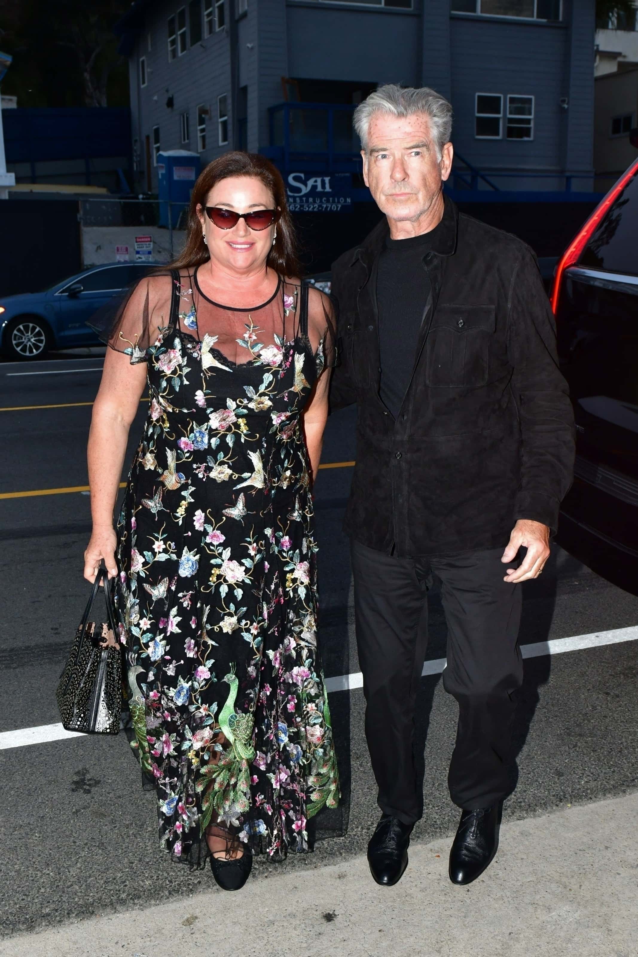 The 69-year-old James Bond star and the 59-year-old journalist and novelist cosied up as they arrived at Giorgio Baldi in Los Angeles' Santa Monica neighbourhood (backgrid)