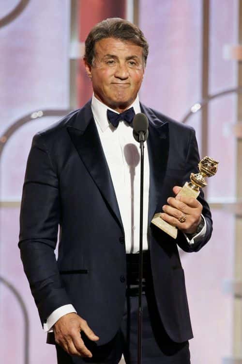 In this handout photo provided by NBCUniversal, Sylvester Stallone accepts the award for Best Supporting Actor - Motion Picture for  