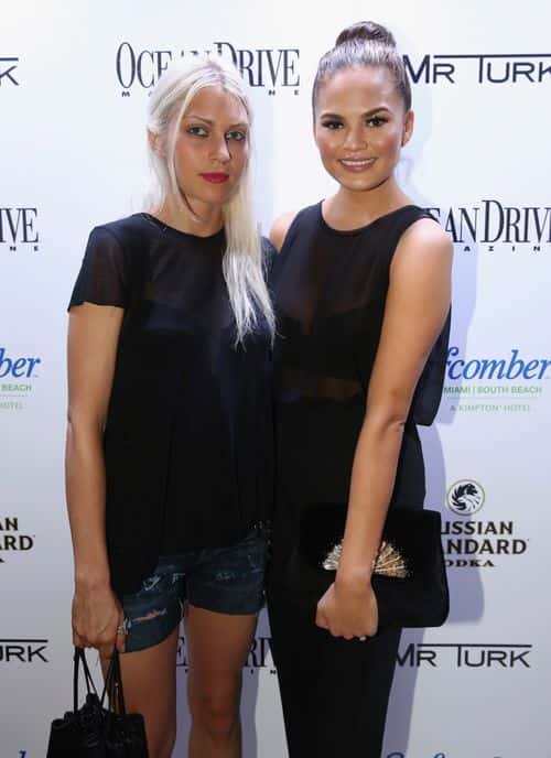 Designer Katie Gallagher (L) and model Chrissy Teigen attend the Ocean Drive Magazine Issue Release Party hosted by cover model Hannah Davis during Mercedes-Benz Fashion Week Swim 2014 on July 18, 2013 in Miami, Florida.