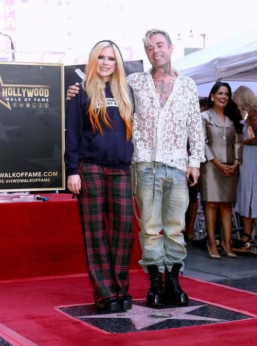(L-R) Avril Lavigne and Mod Sun attend the Hollywood Walk of Fame Star Ceremony celebrating Avril Lavigne on August 31, 2022 in Los Angeles, California.