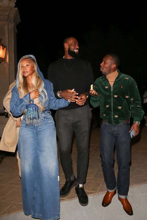Lebron James, his wife Savannah and Rich Paul were spotted outside Leo's party. (Backgrid)