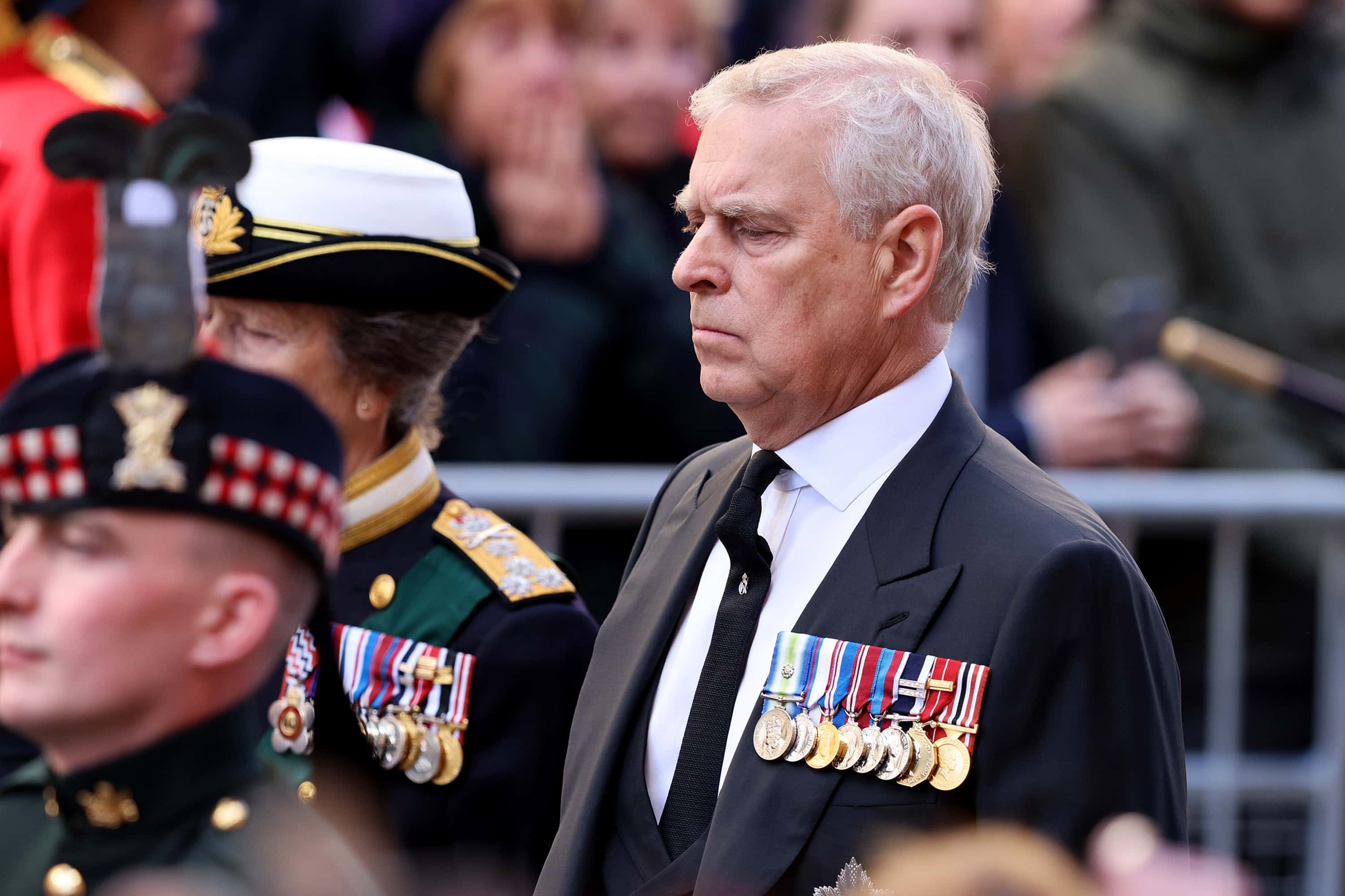 Princess Anne, Princess Royal and Prince Andrew, Duke of York walk behind Queen Elizabeth II's Coffin as it heads to St Giles Cathedral, after making its way along The Royal Mile on September 12, 2022 in Edinburgh, Scotland. King Charles III joins the procession accompanying Her Majesty The Queen's coffin from the Palace of Holyroodhouse along the Royal Mile to St Giles Cathedral. The King and The Queen Consort, accompanied by other Members of the Royal Family also attend a Service of Prayer and Reflection for the Life of The Queen where it lies in rest for 24 hours before being transferred by air to London.