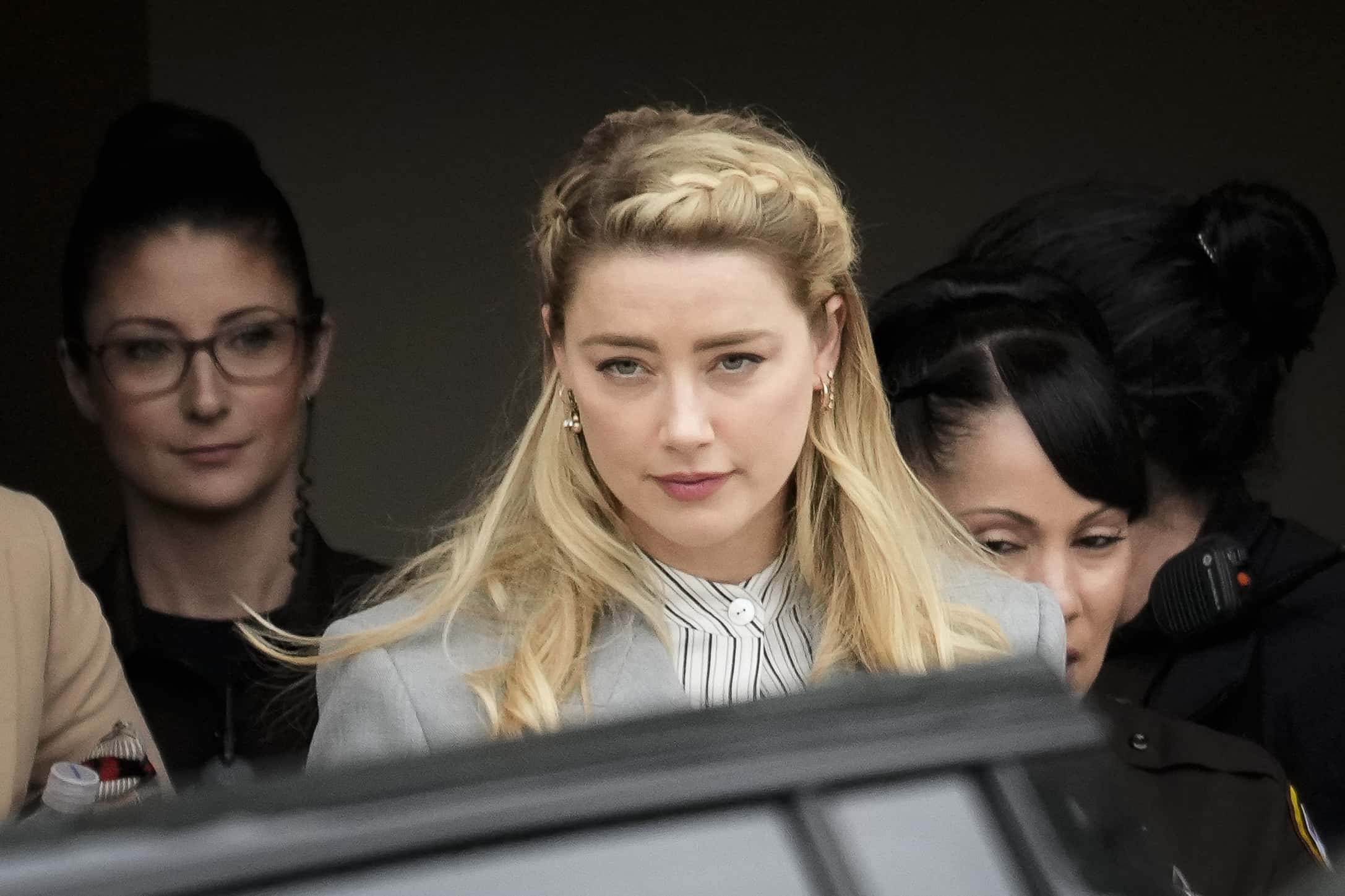 Actress Amber Heard departs the Fairfax County Courthouse on May 27, 2022 in Fairfax, Virginia.&nbsp;Closing arguments in the Depp v. Heard defamation trial, brought by Johnny Depp against his ex-wife Amber Heard, concluded today and jury deliberations begin.