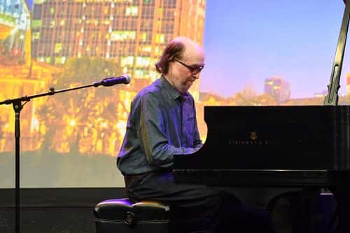 George Winston performs on stage during the American Eagle Awards honoring the Country Music Hall of Fame and Museum George Clinton, and, Vince Guaraldi at Music City Center on July 18, 2019 in Nashville, Tennessee.