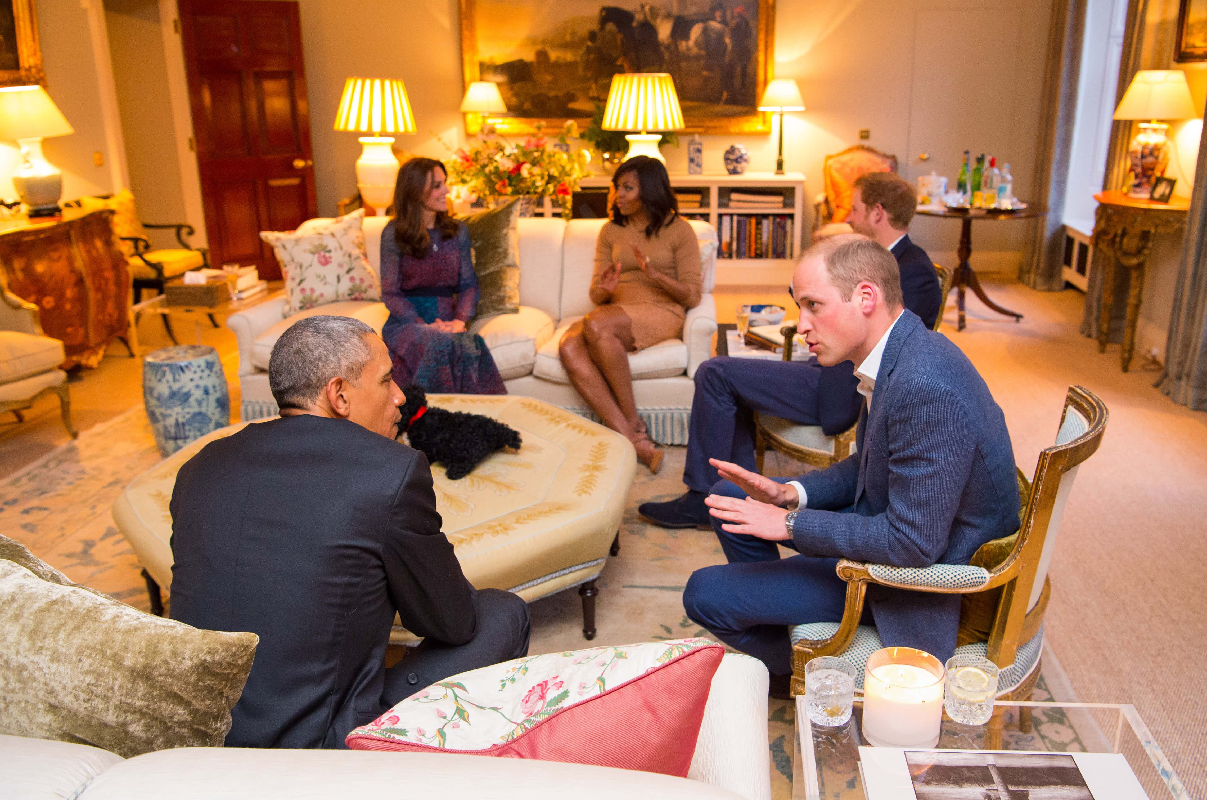 Prince William, Duke of Cambridge speaks with US President Barack Obama as Catherine, Duchess of Cambridge speaks with First Lady of the United States Michelle Obama and Prince Harry in the Drawing Room of Apartment 1A Kensington Palace as they attend a dinner on April 22, 2016 in London, England.  The President and his wife are currently on a brief visit to the UK where they attended lunch with HM Queen Elizabeth II at Windsor Castle and later will have dinner with Prince William and his wife Catherine, Duchess of Cambridge at Kensington Palace. Mr Obama visited 10 Downing Street this afternoon and held a joint press conference with British Prime Minister David Cameron where he stated his case for the UK to remain inside the European Union.