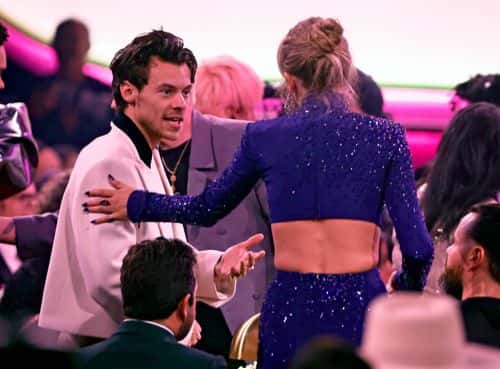 (FOR EDITORIAL USE ONLY) (L-R) Harry Styles and Taylor Swift speak during the 65th GRAMMY Awards at Crypto.com Arena on February 05, 2023 in Los Angeles, California.