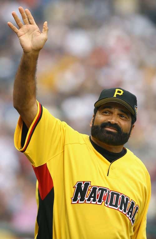 Football legends Franco Harris waves to the crowd before the Taco Bell All-Star Legends & Celebrity Softball Game at PNC Park on July 9, 2006 in Pittsburgh, Pennsylvania. (Photo by Al Bello/Getty Images)