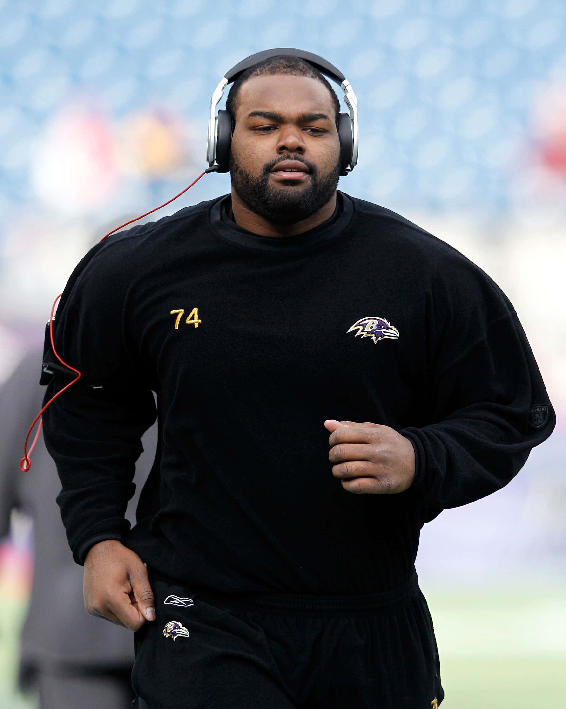 Michael Oher #74 of the Baltimore Ravens warms up prior to their AFC Championship Game against the New England Patriots at Gillette Stadium on January 22, 2012 in Foxboro, Massachusetts.
