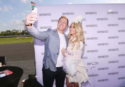 NFL Player Kroy Biermann (L) and TV Personality Kim Zolciak attend as Kim Zolciak hosts the Kentucky Derby hat contest at Empire City Casino at Yonkers Raceway on May 6, 2017 in Yonkers, New York.