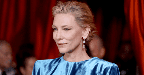 Cate Blanchett wearing a blue dress and a blue pin at the 2023 Oscars.(Photo by Mike Coppola / Getty Images)