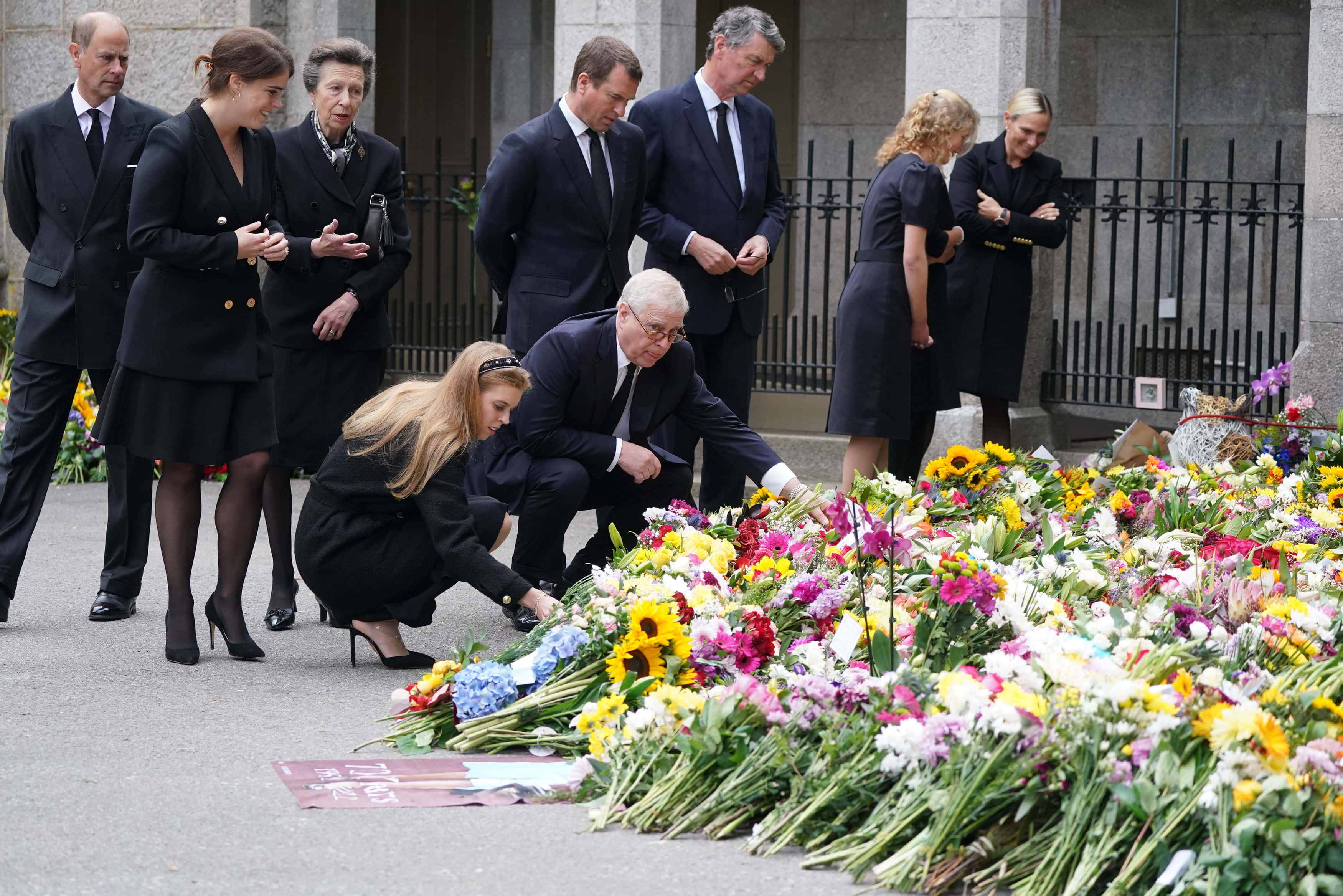 Princess Beatrice of York, Peter Phillips, Zara Tindall, Lady Louise Windsor, Sophie, Countess of Wessex, Prince Andrew, Duke of York, Edward, Earl of Wessex, Princess Anne, Princess Royal and Vice Admiral Timothy Laurence look at messages and floral tributes left by members of the public after attending a service at Crathie Kirk church near Balmoral following the death of Queen Elizabeth II on September 10, 2022 in Crathie near Aberdeen, United Kingdom. Elizabeth Alexandra Mary Windsor was born in Bruton Street, Mayfair, London on 21 April 1926. She married Prince Philip in 1947 and acceded to the throne of the United Kingdom and Commonwealth on 6 February 1952 after the death of her Father, King George VI. Queen Elizabeth II died at Balmoral Castle in Scotland on September 8, 2022, and is succeeded by her eldest son, King Charles III.